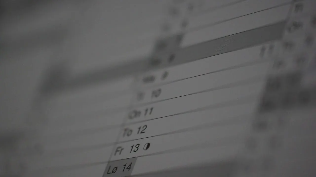 A calendar page fading into shadow — expiry dates arriving faster than a manual reminder can track.
