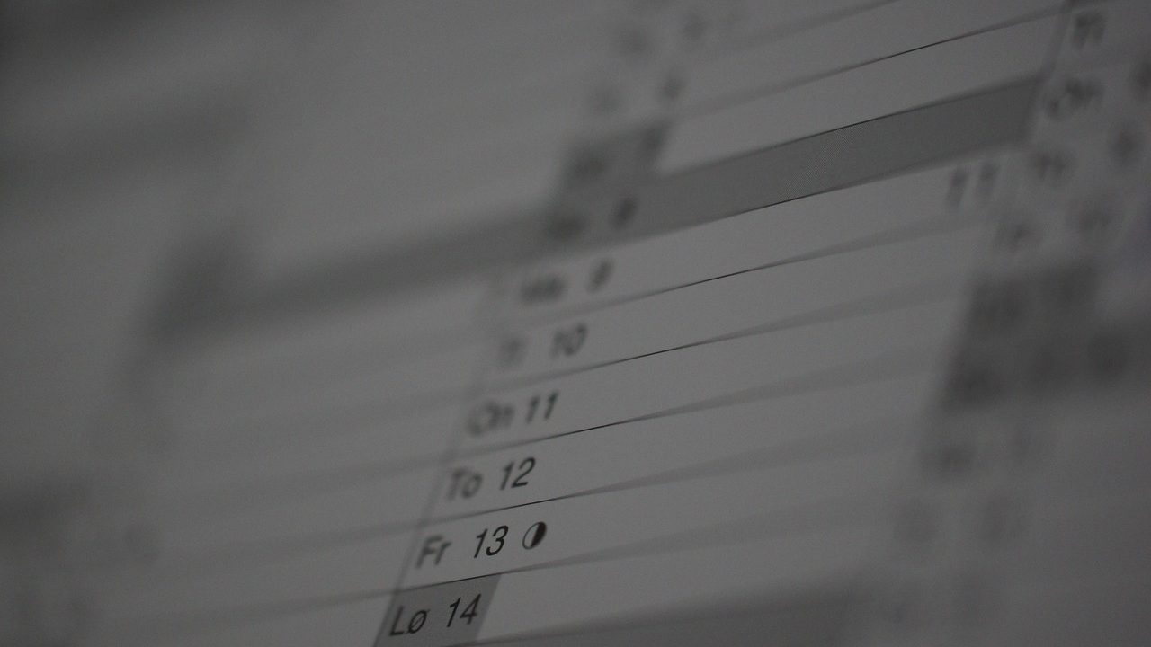 A calendar page fading into shadow — expiry dates arriving faster than a manual reminder can track.
