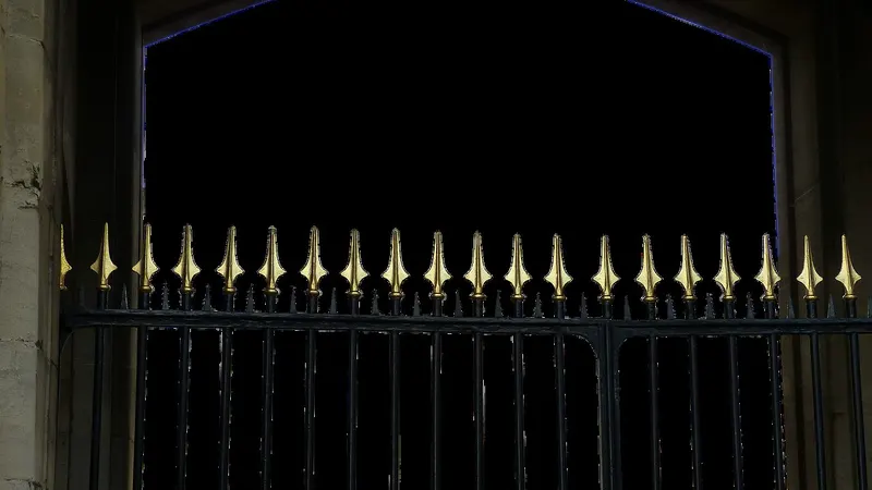A dim locked gate at night — a paid customer still shut out because the subscription never switched on.
