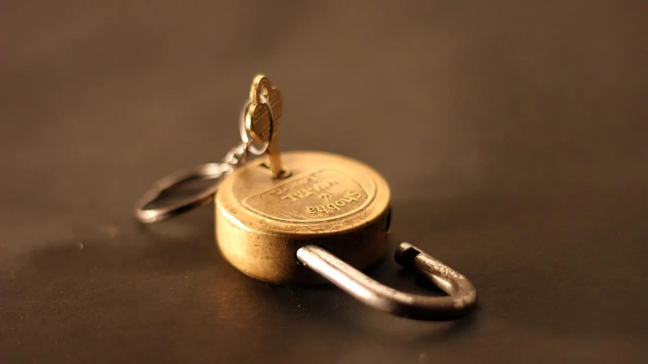 An unlocked padlock in low light — a site served without a private, secure connection.