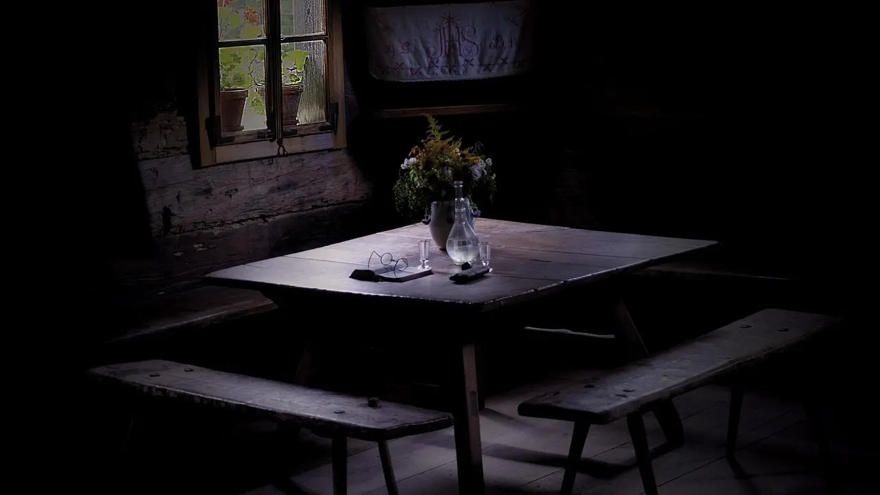 A single light flickering on in a dark room — an idle app waking up for the first visitor.